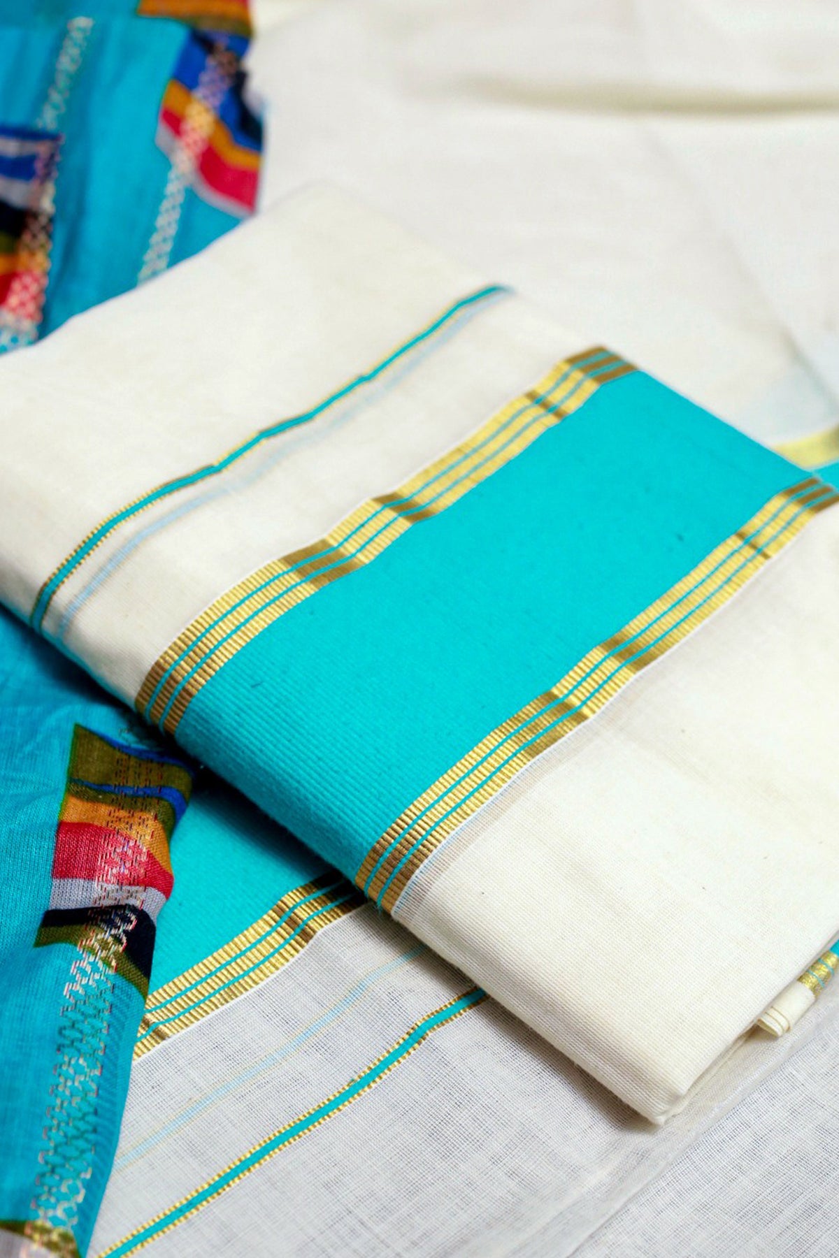 Karthika- Blue and Golden Kasav Settumund with Designer Blouse Material