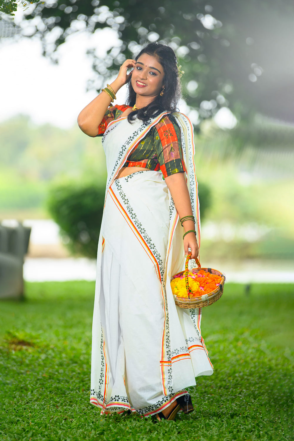 Chandrika – Orange and Golden Kasav Settumund with Printed Border and Designer Blouse Material
