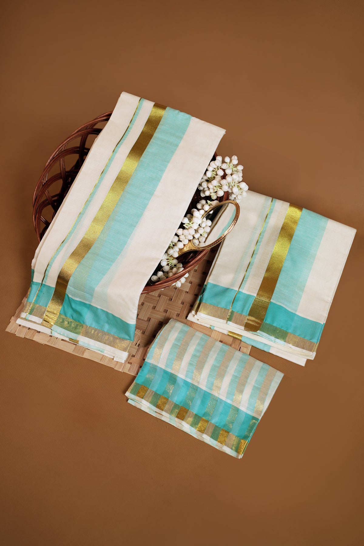 Radhika – Premium Kasav Settumund with Matching Striped Weave Blouse Material