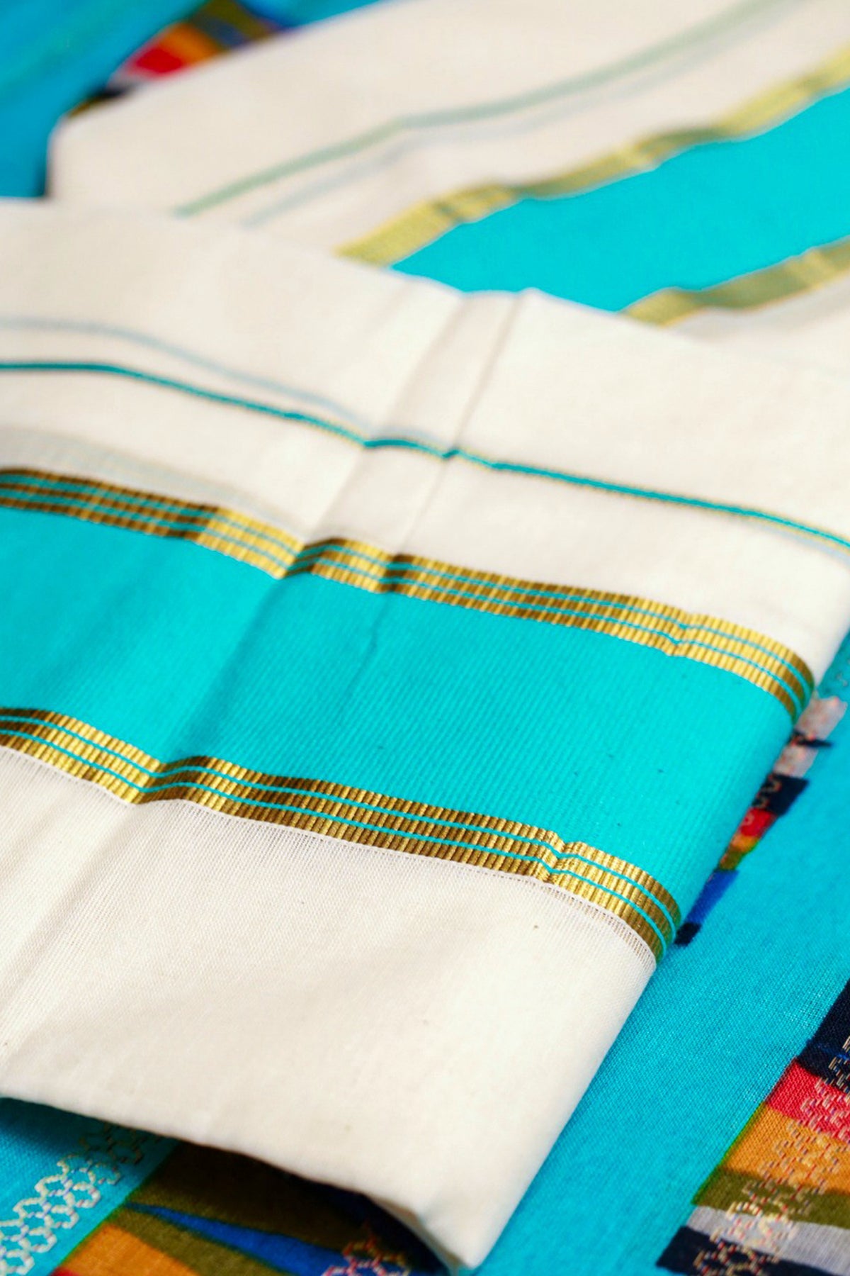 Karthika- Blue and Golden Kasav Settumund with Designer Blouse Material