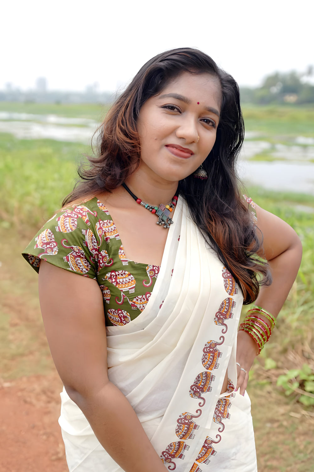 Gajashoba- Green Elephant Printed Settumund with Matching Printed Green Blouse Material