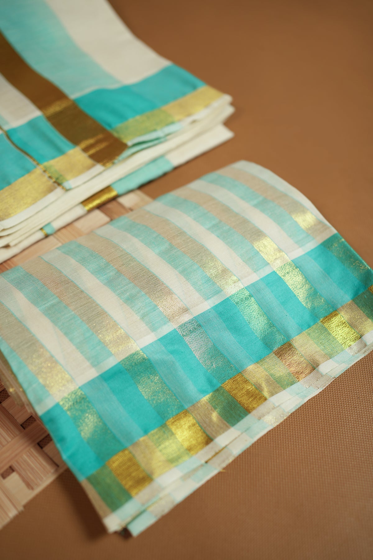 Radhika – Premium Kasav Settumund with Matching Striped Weave Blouse Material