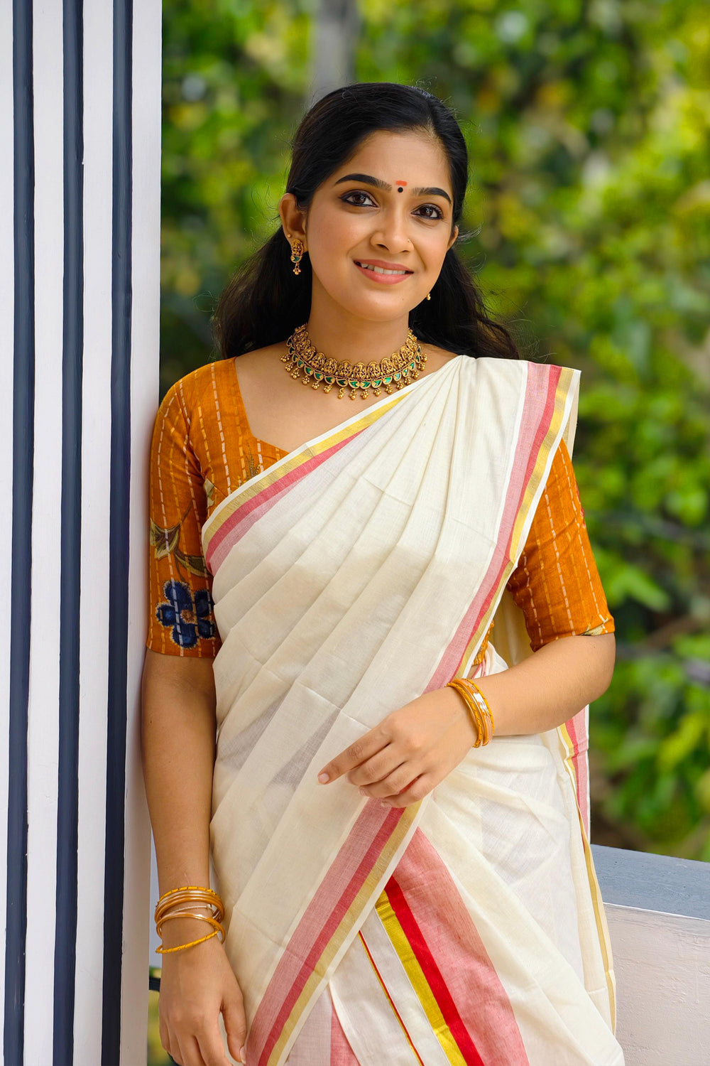 Chendumalli – Yellowish Orange and Golden Kasavu Settumund with Designer Blouse Material