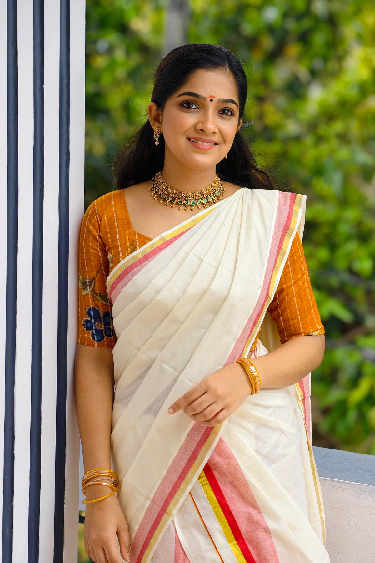 Chendumalli – Yellowish Orange and Golden Kasavu Settumund with Designer Blouse Material