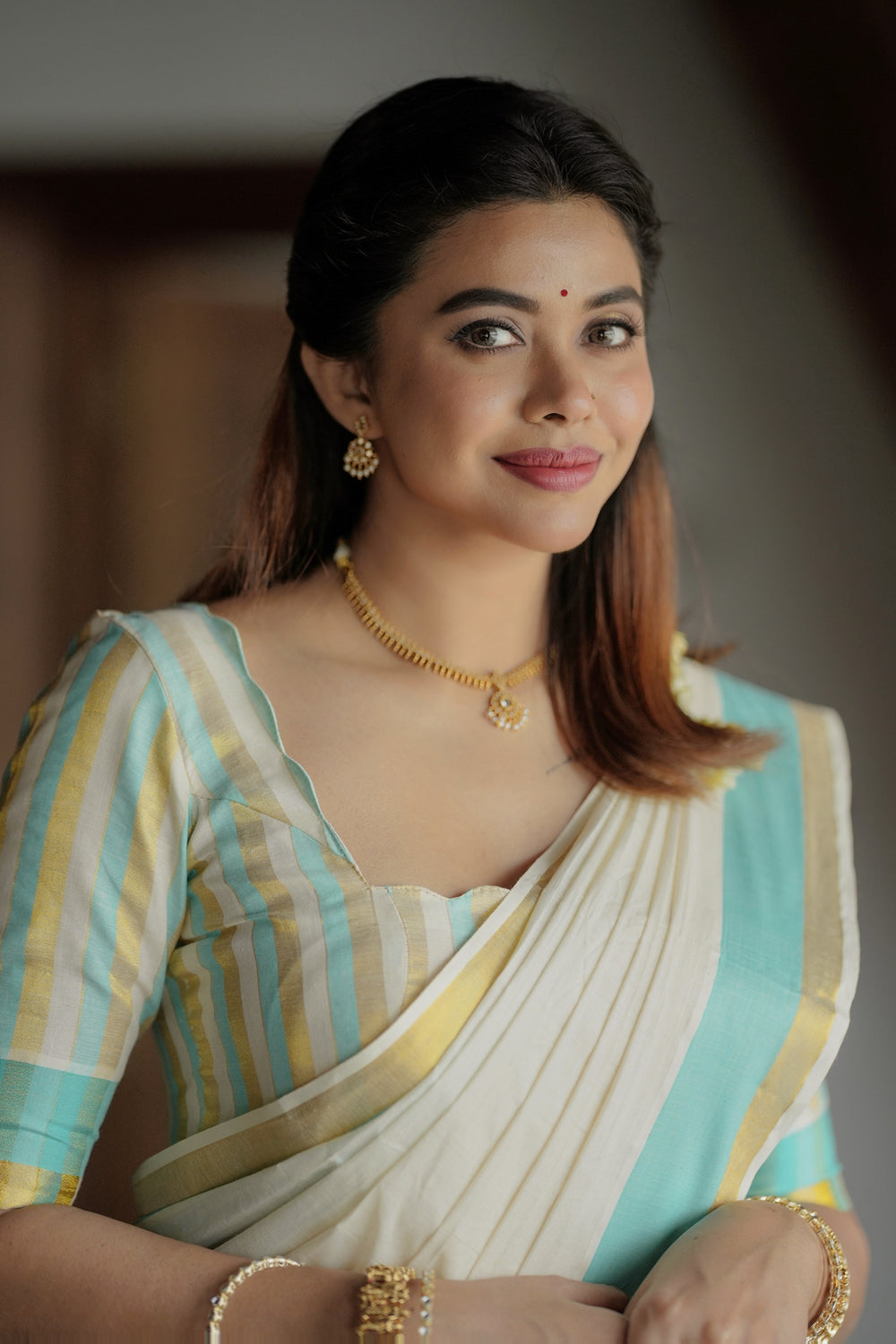 Radhika – Premium Kasav Settumund with Matching Striped Weave Blouse Material
