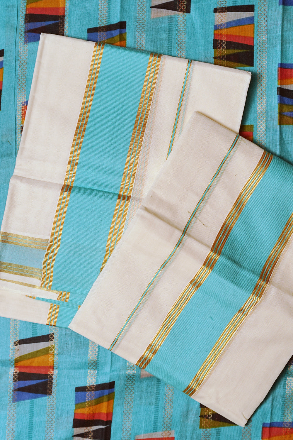 Karthika- Blue and Golden Kasav Settumund with Designer Blouse Material