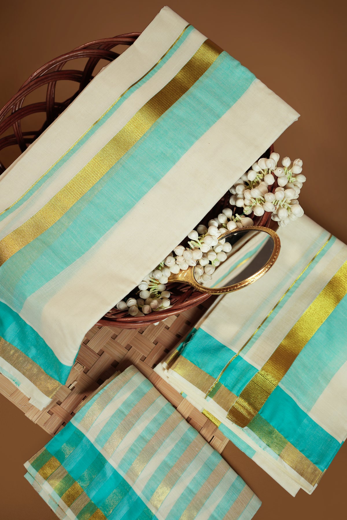 Radhika – Premium Kasav Settumund with Matching Striped Weave Blouse Material