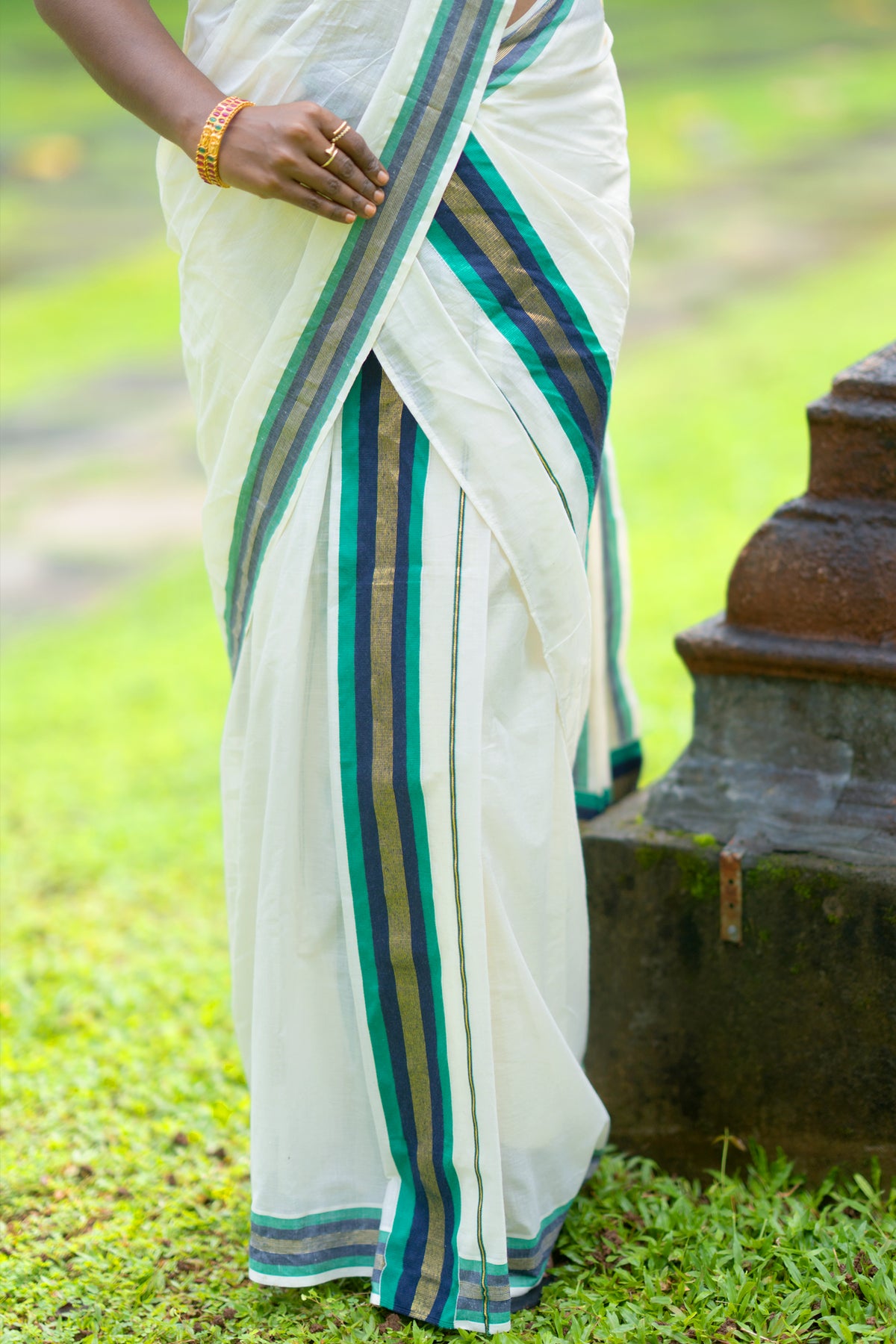 Hiranmayi Settumundu with Green & Light Golden Border and Matching Blouse Material