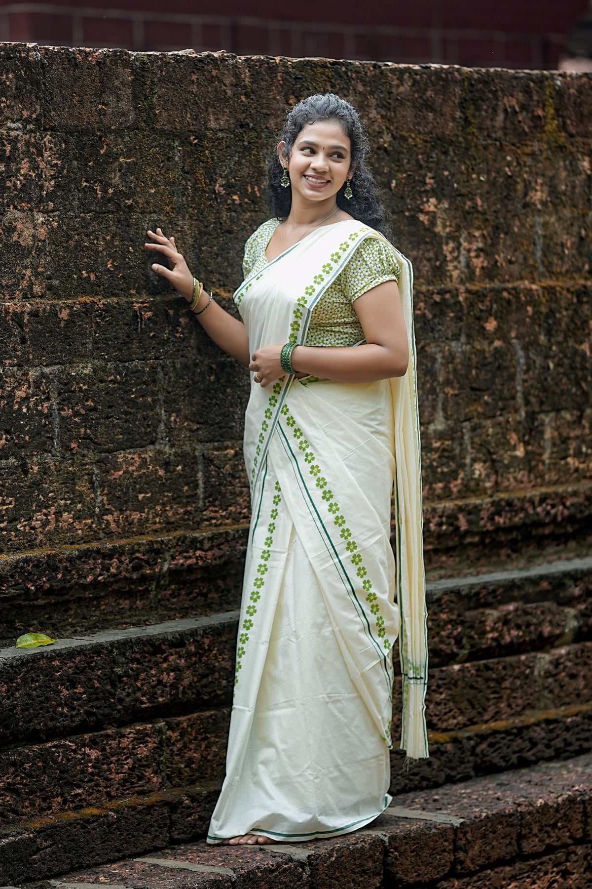 Arunima -Green Floral Printed Puliyilakkara Settumund with Matching Floral Blouse Material