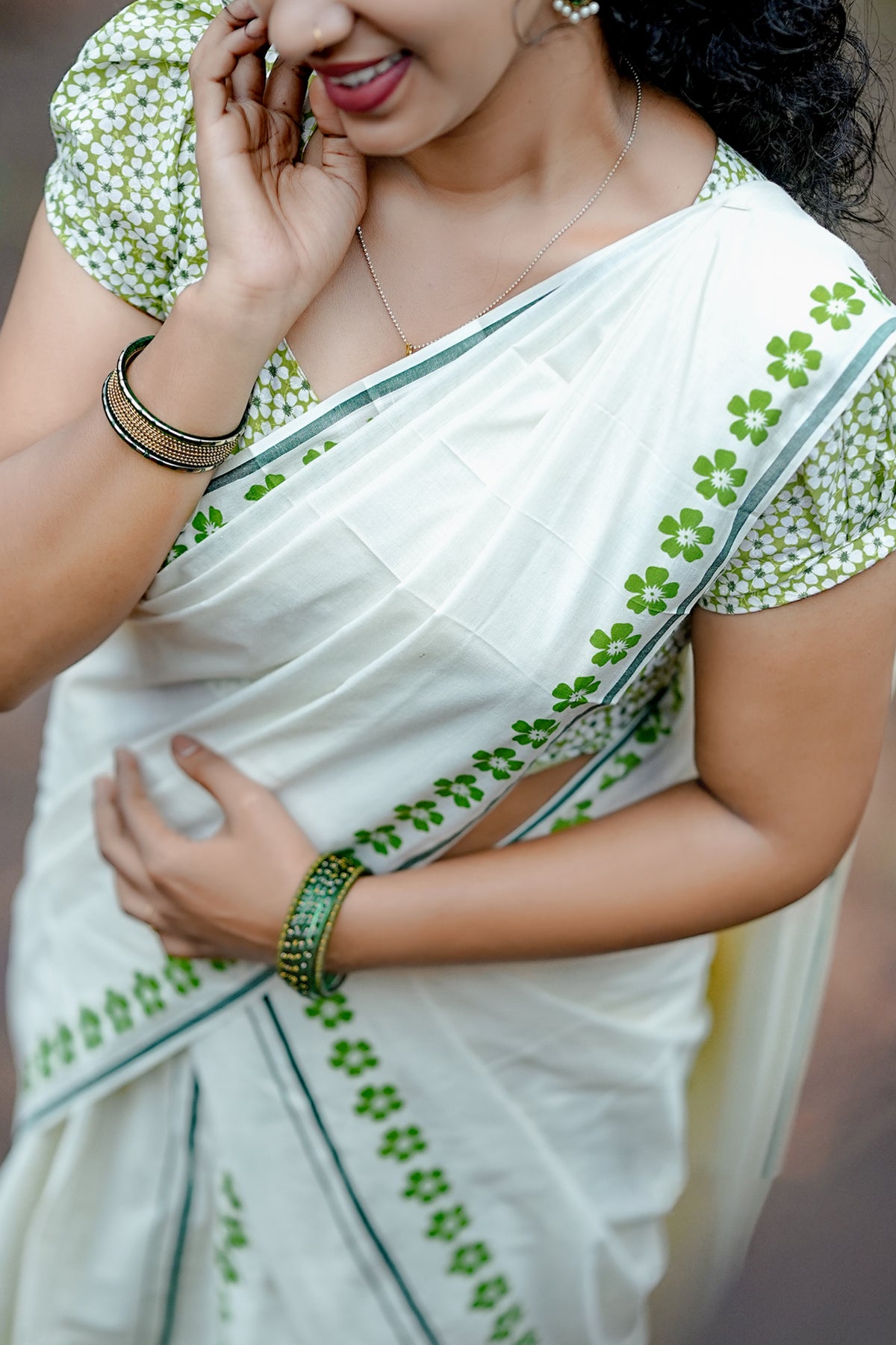 Arunima -Green Floral Printed Puliyilakkara Settumund with Matching Floral Blouse Material
