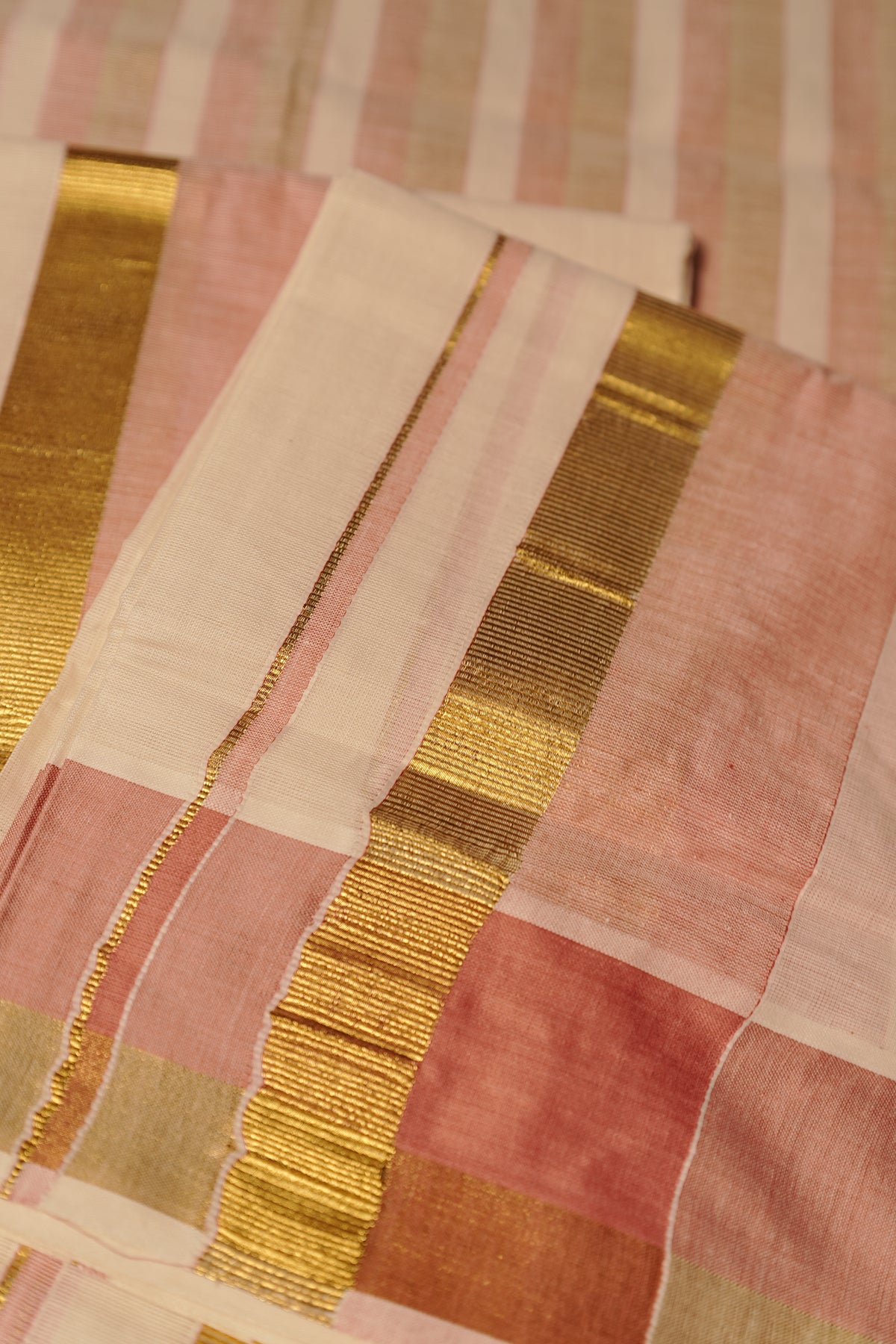 Jyothika – Premium Kasav Settumund with Matching Striped Weave Blouse Material