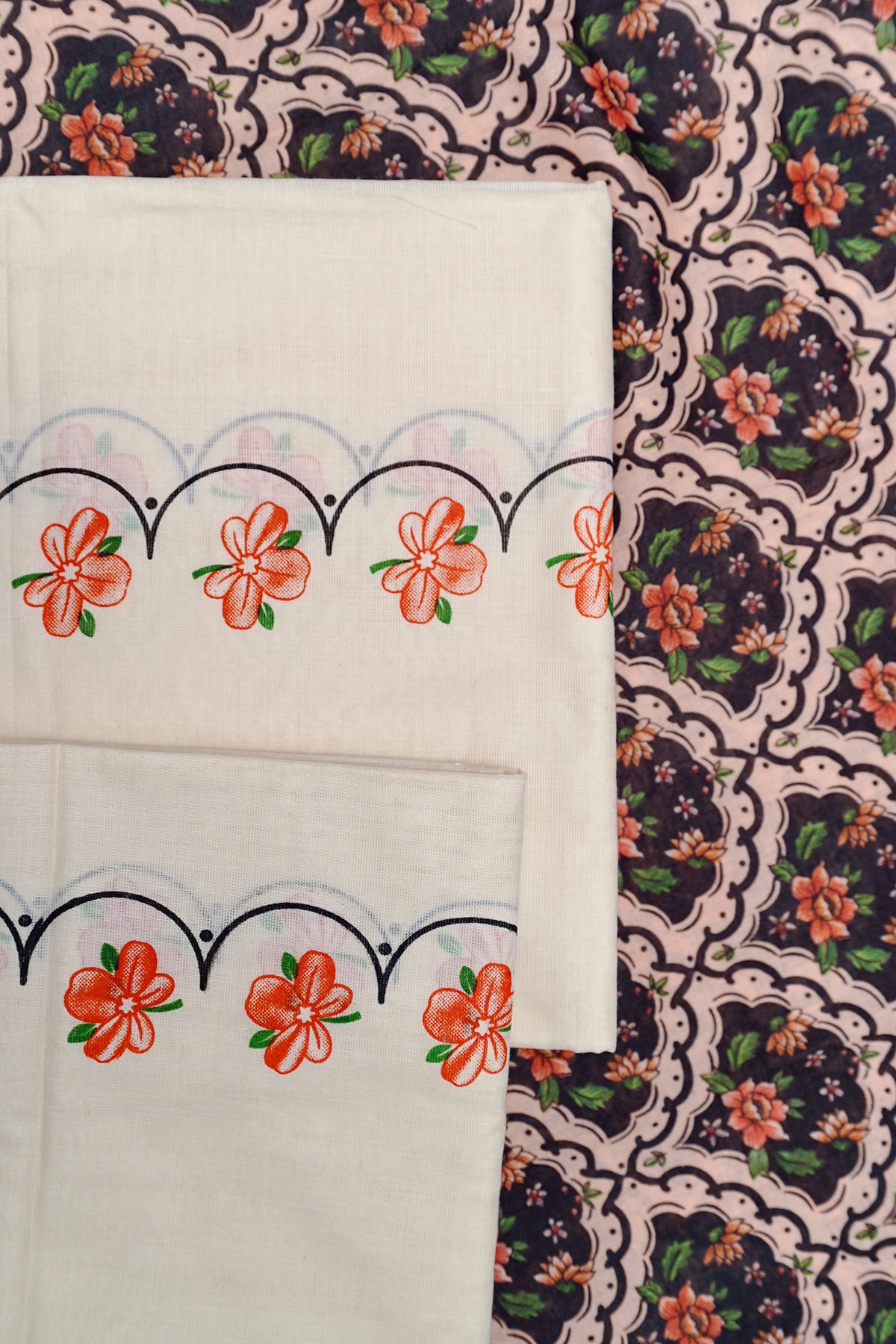 Kanakambaram- Orange and Green Kanakambaram Printed Settumund With Matching Blouse Material