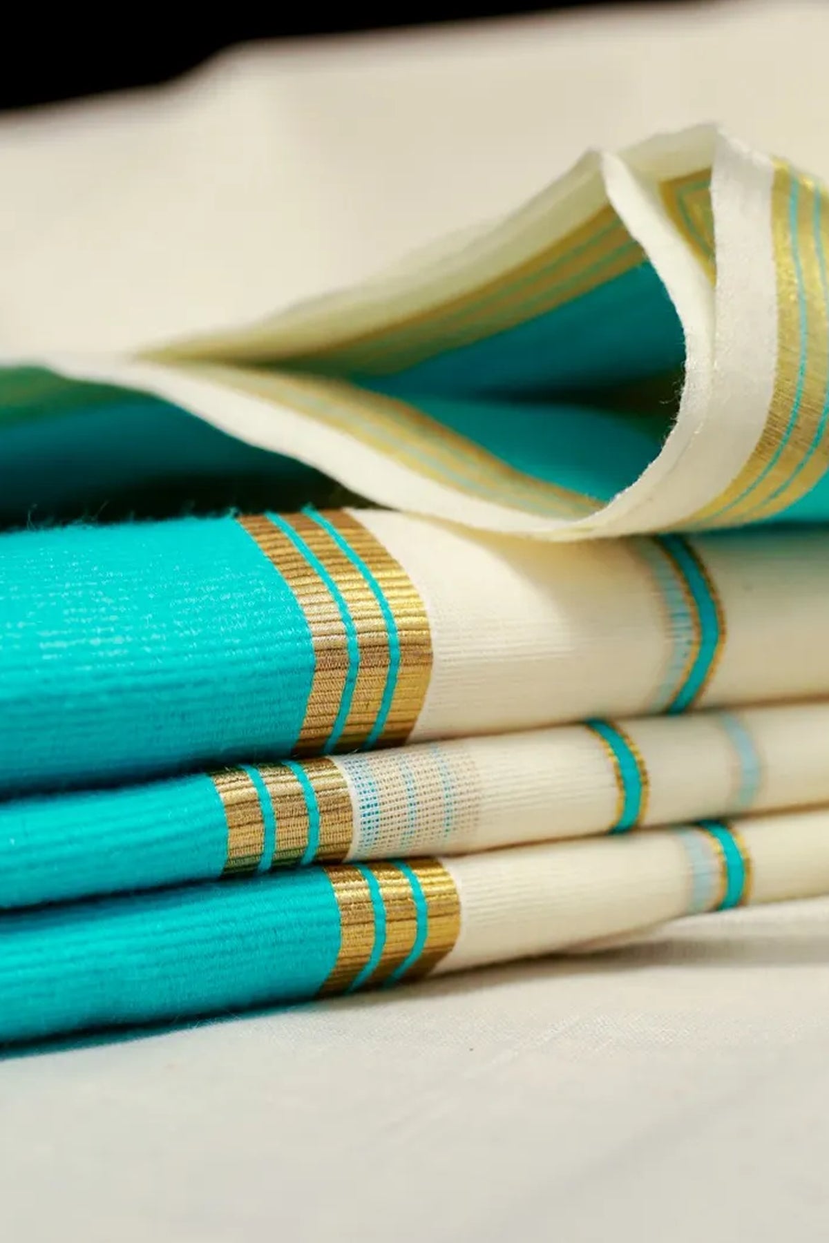 Karthika- Blue and Golden Kasav Settumund with Designer Blouse Material