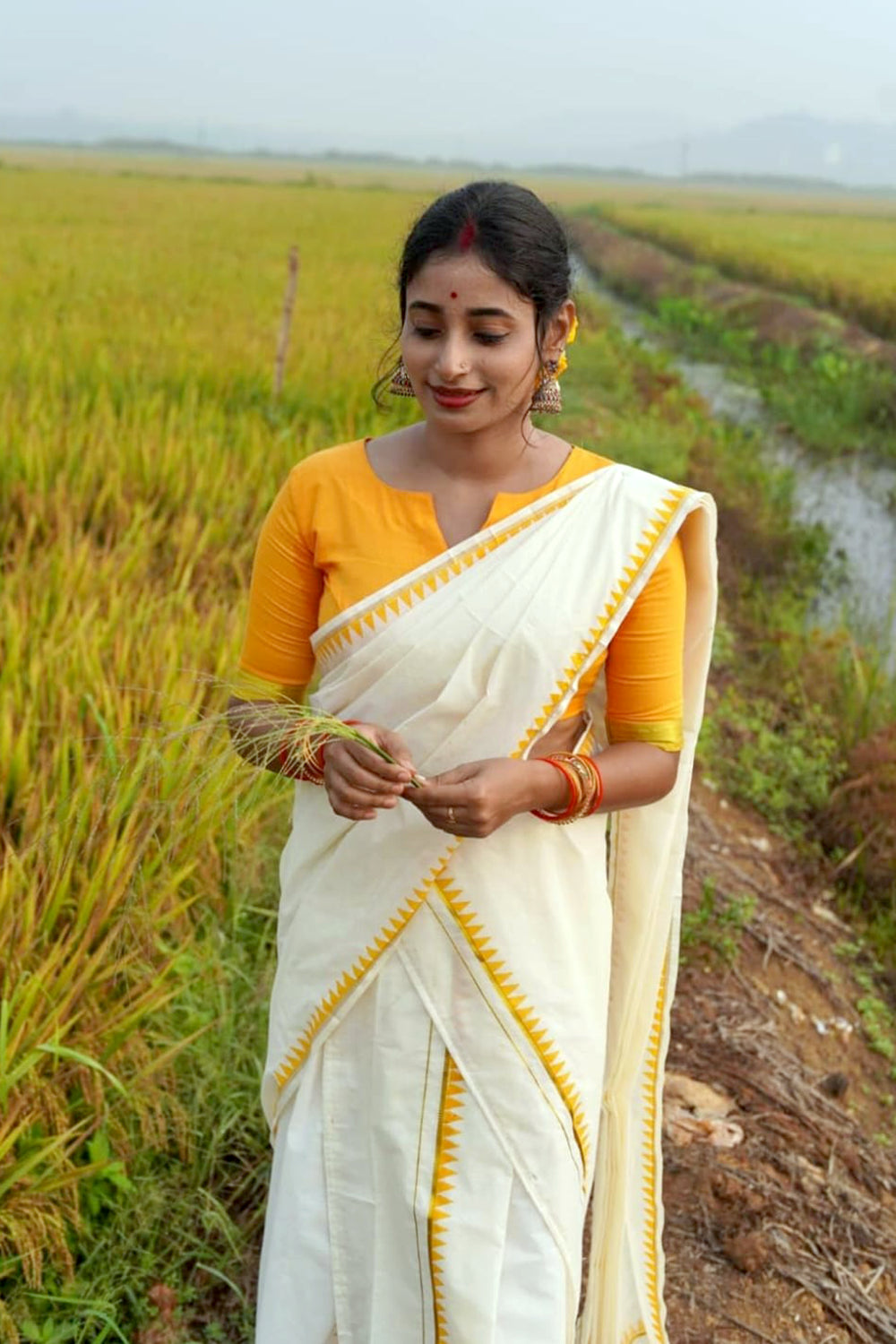 Madhavi – Yellow Temple Printed Settumund with Kasav Border Blouse Material