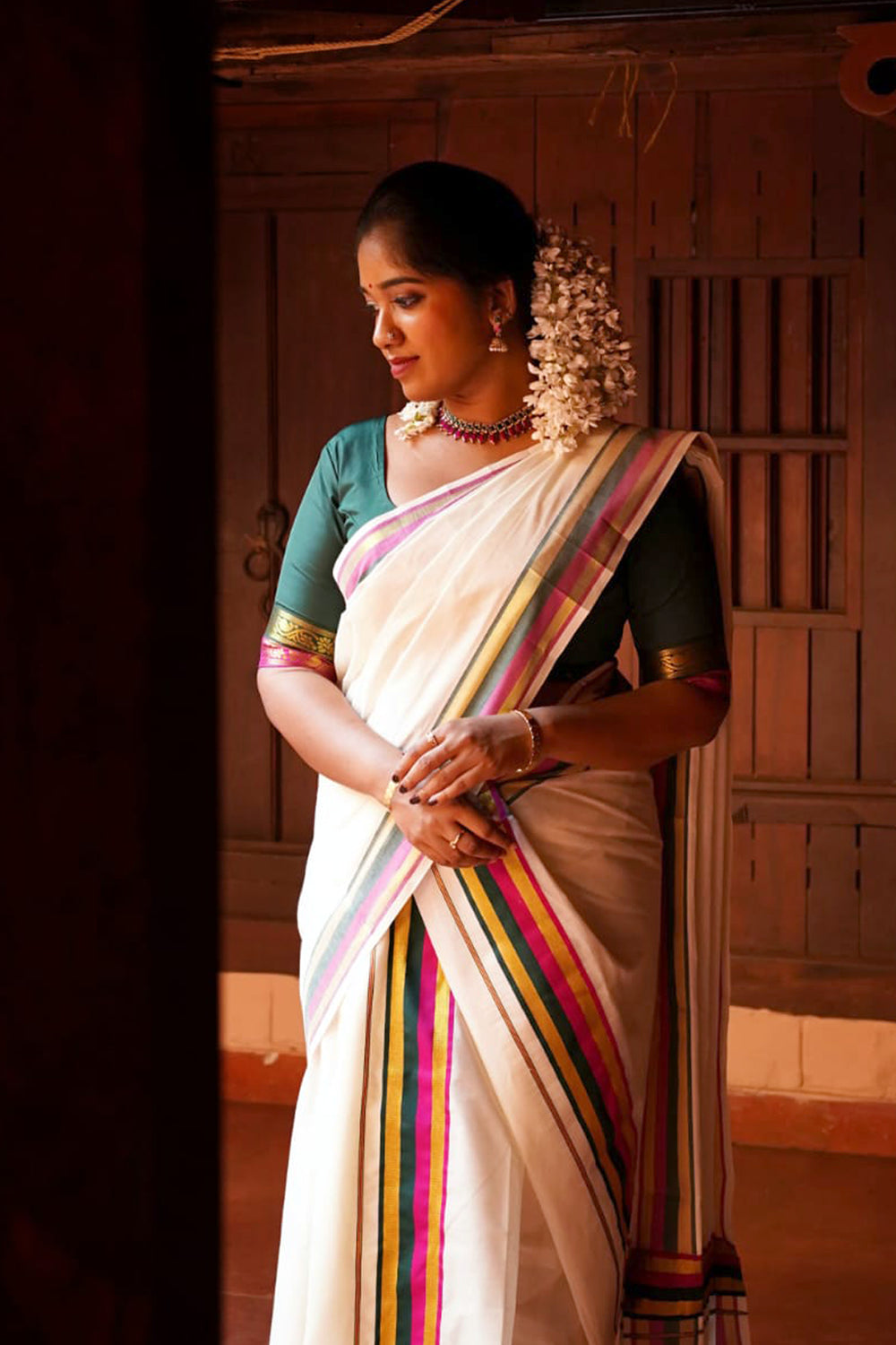 Sindhu – Magenta and Green Kasav Settumund with Matching Blouse Material