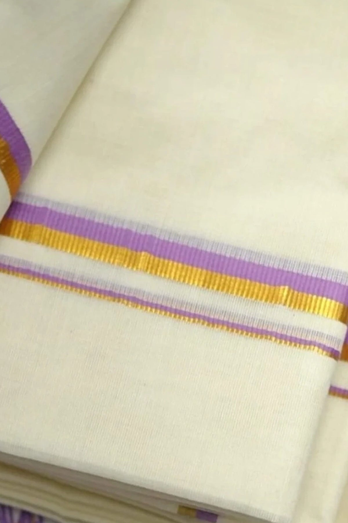 Vaikha – Lavender and Golden Kasav Puliyilakkara Settumund with Floral Printed Blouse Material