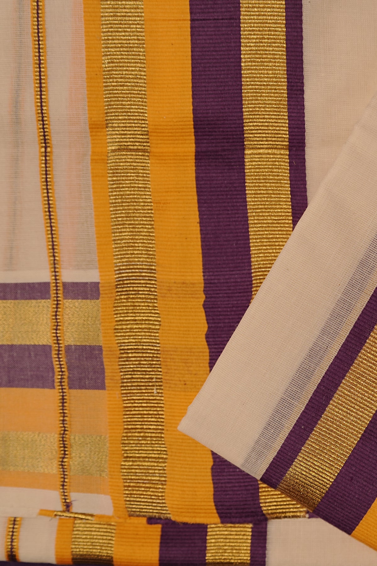 Yamuna – Violet and Yellow Kasav Settumund with Matching Blouse Material