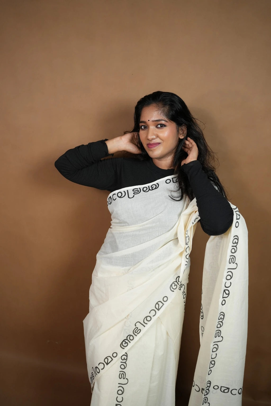 Model wearing Abhiramam Printed Settumund, full styling