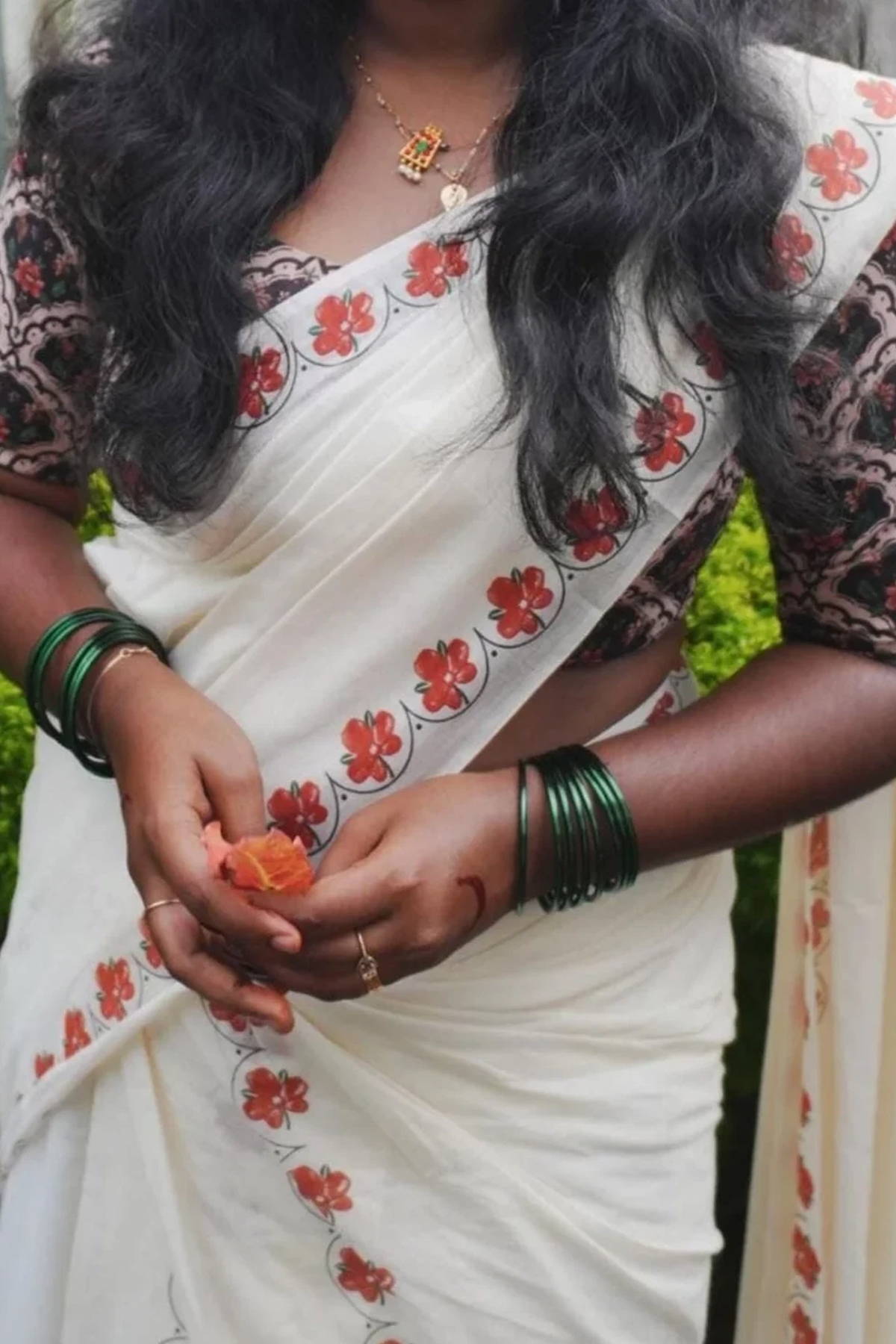 Kanakambaram- Orange and Green Kanakambaram Printed Settumund With Matching Blouse Material