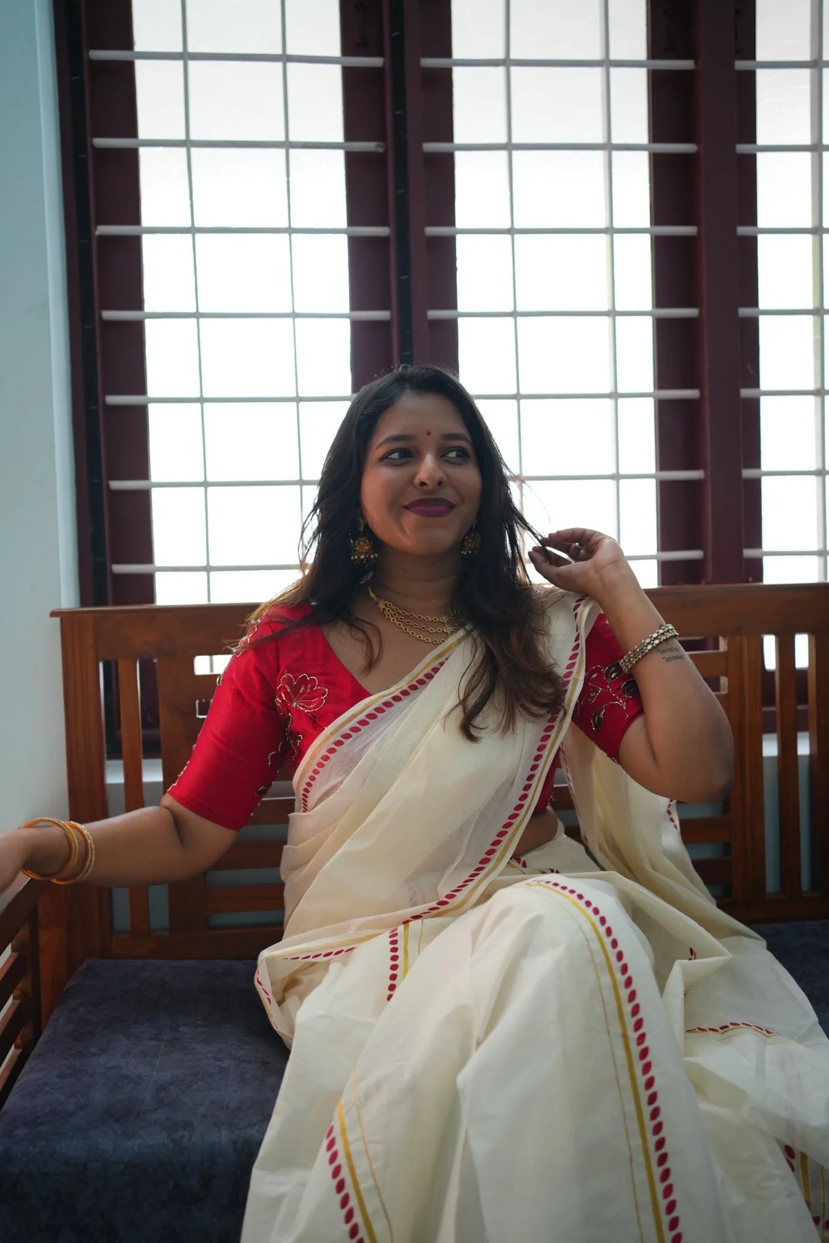 Red Glitter Print Settumundu - seated portrait