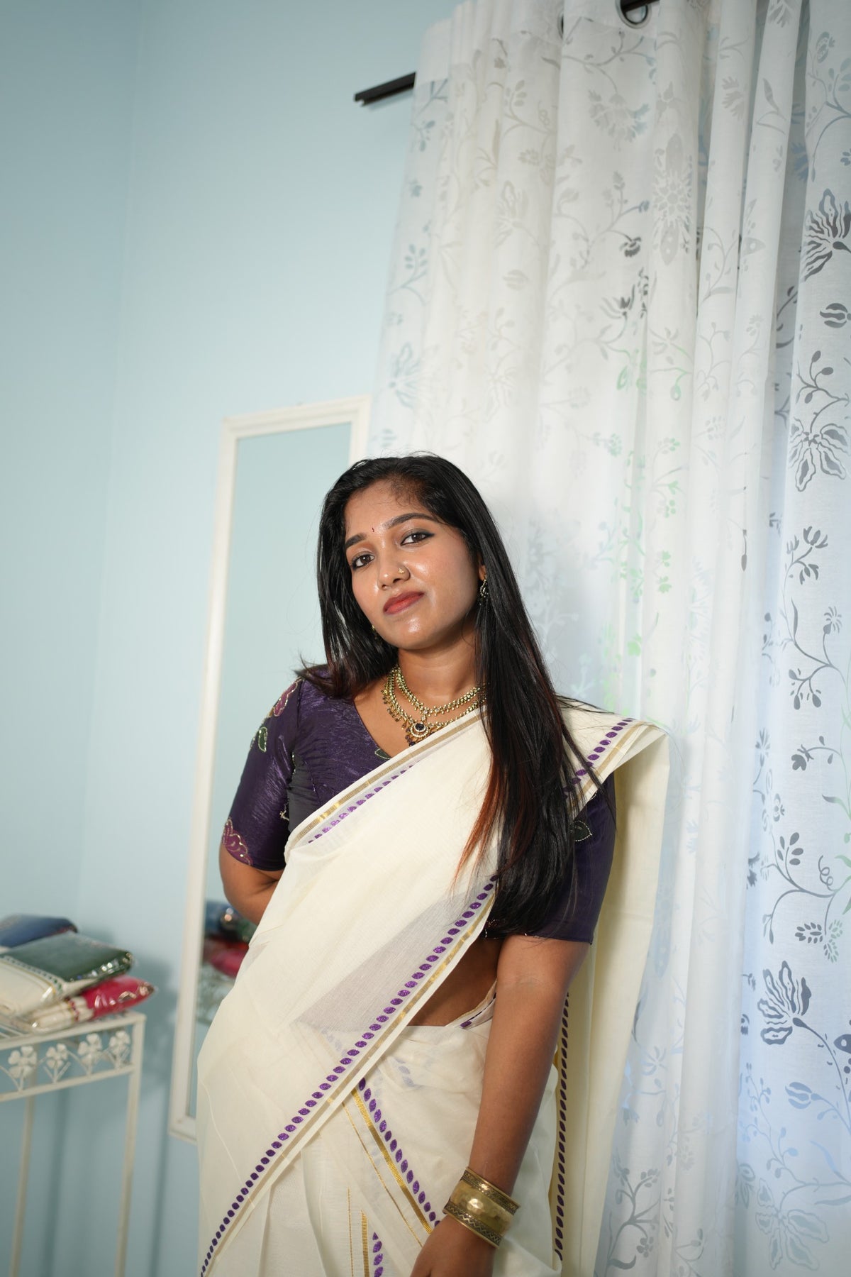 Violet glitter print Settumundu with matching blouse material, front view