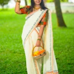 Chandrika – Orange and Golden Kasav Settumund with Printed Border and Designer Blouse Material