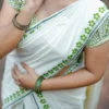 Arunima -Green Floral Printed Puliyilakkara Settumund with Matching Floral Blouse Material