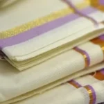 Vaikha – Lavender and Golden Kasav Puliyilakkara Settumund with Floral Printed Blouse Material