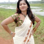 Gajashoba- Green Elephant Printed Settumund with Matching Printed Green Blouse Material