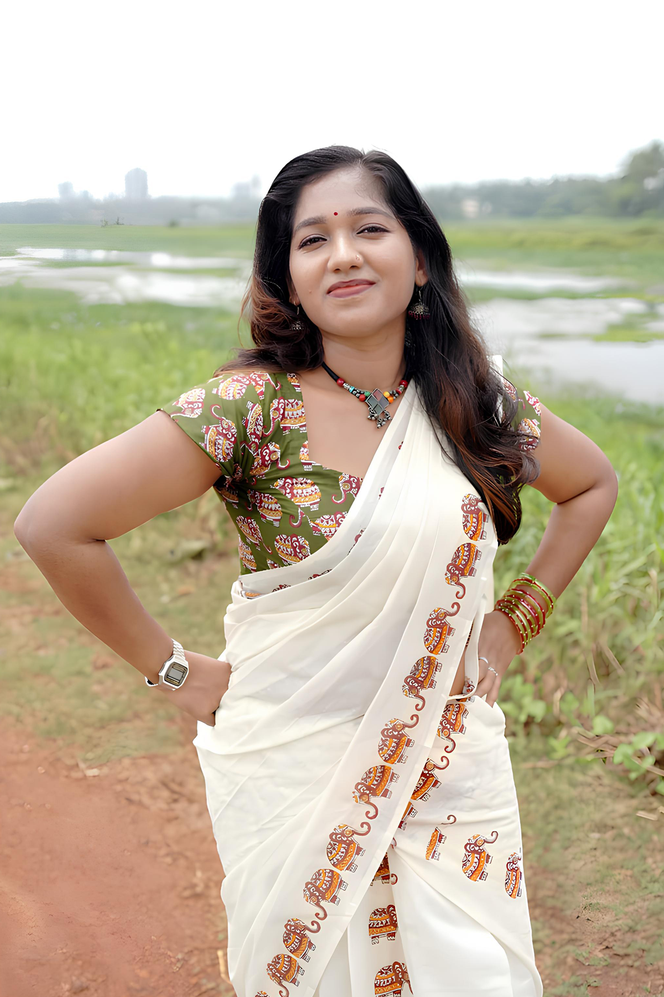 Gajashoba- Green Elephant Printed Settumund with Matching Printed Green Blouse Material