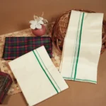 Ananya - Green Puliyilakkara Settumund with Checked Blouse Material