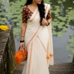 Pavithra -Orange puliyilakkara with blouse material