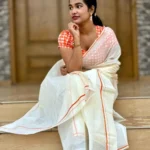 Tapasya -Orange puliyilakkara -premium cotton settmund with check blouse