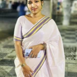 Ameya - Rose Tissue Saree with Purple and Golden Borders Paired with Designer Blouse Material