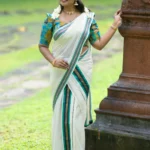 Hiranmayi Settumundu with Green & Light Golden Border and Matching Blouse Material