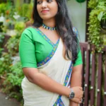 Mayoora Green Settumundu with Stitched Multicolor Border and Plain Blouse Material