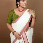 Warly Settumundu with Green Border and Matching Blouse Material